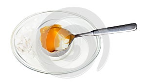 Top view of eating of soft-boiled egg with spoon