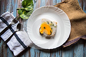 Top view of egg poach on bread in a white plate photo