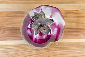 Top view of eggplant Helios on a wooden surface