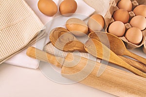 Top view of eggs and utensils on table