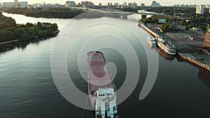 Top view of empty barge without cargo float along the river in summer sunny day