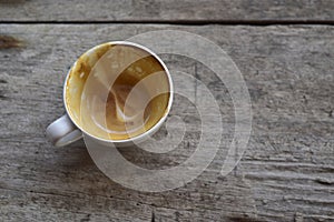 top view Empty coffee cup after drink on old wood table and copy space. selective focus