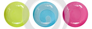 Top view of empty colorful plates isolate on white background