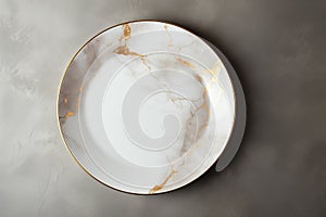 Top view of an empty fancy marble colored plate with a golden rim.