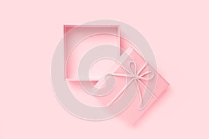 Top view of empty open pink gift box for congratulations on pink background