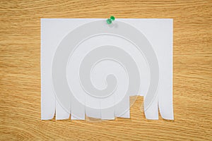 top view of empty paper for ads with drawing pin on wooden