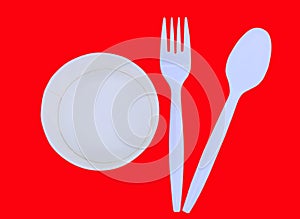 Top view of empty paper cup with spoon and fork