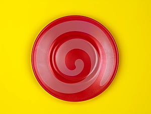 Top view of empty red dish vibrant color background