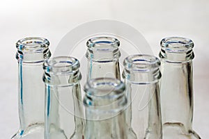 Top view of empty soft drinks glass bottles on the floor. Close up.