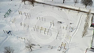 Top view of an empty sports field in a winter park. Infrastructure for winter sports