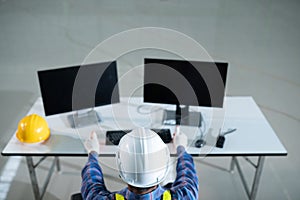 Top View engineering computer using operate in the warehouse office