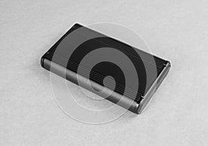 Top view of external computer hard disk drive on gray background