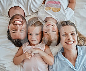 Top view, family and portrait in bedroom home, bonding or having fun. Love, care and happy kids or girls, mother and