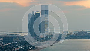 Top view of famous towers buildings in Abu Dhabi day to night timelapse.