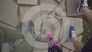 Top view of the feet walking up the stairs.