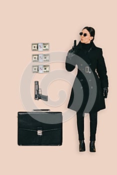 top view of female killer in sunglasses with briefcase handguns and cash