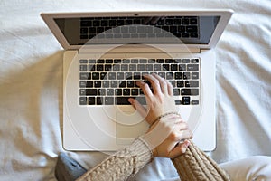 Top view of a female worker with wrist pain from working on the computer. photo