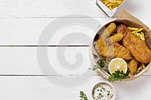 top view fish chips bowl with lemon. High quality photo