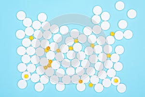 Top view of fish oil for good health on a white background from pills. Omega-3 fat capsules are yellow on a blue background and wh