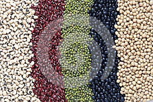 Top view of Five colored beans on wooder background, Healthy eating concept