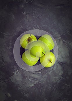 Top view of five fresh raw and whole green apples