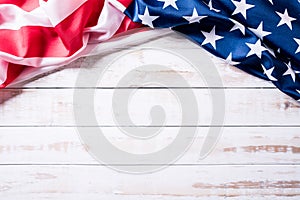Top view of Flag of the United States of America on white wooden background. Independence Day USA, Memorial