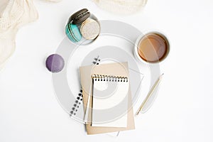 Top view flat lay Blank notebook mockup with macarons and tea cup