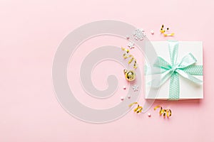 Top view Flat lay Christmas decorations and gift box on colored background with copy space. Christmas or Happy New Year