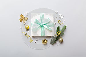 Top view Flat lay Christmas decorations and gift box on colored background with copy space. Christmas or Happy New Year