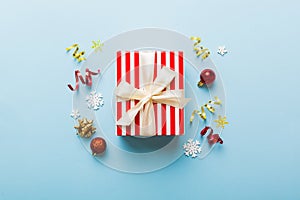 Top view Flat lay Christmas decorations and gift box on colored background with copy space. Christmas or Happy New Year