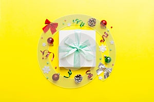 Top view Flat lay Christmas decorations and gift box on colored background with copy space. Christmas or Happy New Year