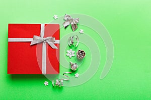 Top view Flat lay Christmas decorations and gift box on colored background with copy space. Christmas or Happy New Year