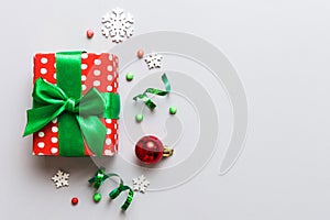 Top view Flat lay Christmas decorations and gift box on colored background with copy space. Christmas or Happy New Year