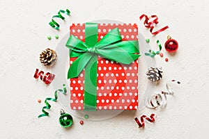 Top view Flat lay Christmas decorations and gift box on colored background with copy space. Christmas or Happy New Year