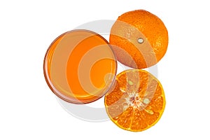 Top view or flat lay of fresh orange juice in transparent glass