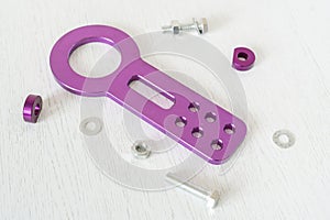 a top view of flat lay of new car part towing hook isolated