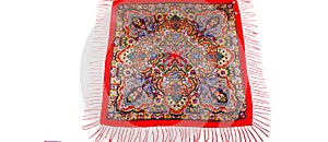 top view flat lay on red cotton scarf with fringe and colorful paisley pattern
