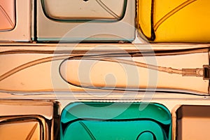Top view, flat lay of a set of perfume bottles on a nude background.