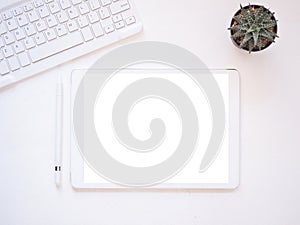 Top view, flat lay template, mock-up digital tablet pc computer with blank white screen.
