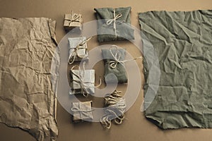 flat lay textile and craft paper gift boxes on a brown background