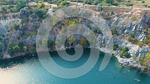 Top view of a flooded and abandoned granite quarry