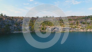 Top view of a flooded and abandoned granite quarry