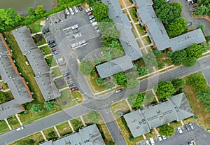 Top view flying over town home showing family houses with roofs