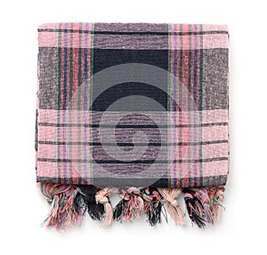 Top view of folded plaid cloth with tassels