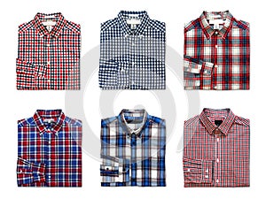 Top view of folded red, blue and white color long sleeve plaid shirts isolated on white background