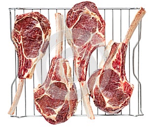 Four Frenched Bone In Raw Veal Tomahawk Chops photo