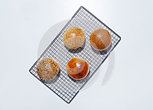 Top view of four freshly baked small breads