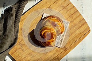 Top view of fresh Argentinean empanadilla illuminated by sunlight photo