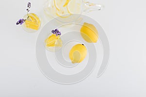 top view of fresh citrus drinks with lavender flowers in glasses and jar