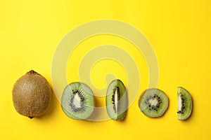 Top view of fresh cut and whole kiwis